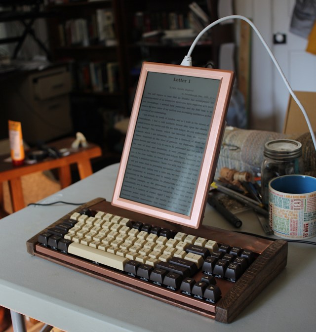 word processor with vertical screen and keyboard, made of copper and dark stained oak with brown retro-styled keys